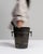 This mid 20th century ice bucket from France is finished in chocolate, worked in silver. Its form follows honest, well-...