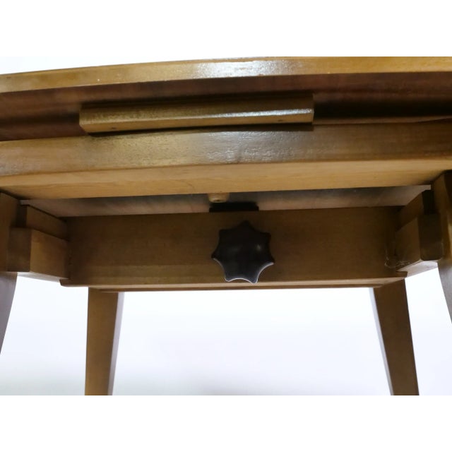 Teak dining table and coffee table combination from the 1960s. Extendable tabletop with rounded edges and a height-...