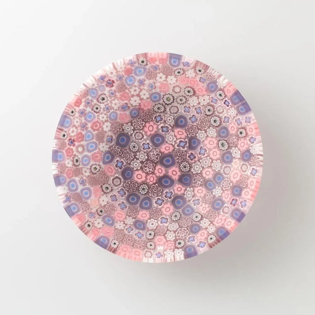 Murano glass bowl made by melting together sections of glass rods in a furnace, with each section depicting a small...