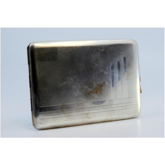 Guilloche Silver Cigarette Case with Polished Bands, in Very Good conditions. Designed 1890 to 1919 This piece has an...