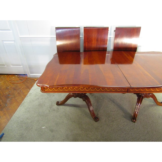 Item 87824: Pennsylvania House solid cherry Chippendale style dining table. Age: 1990's. Details: Three leaves for...