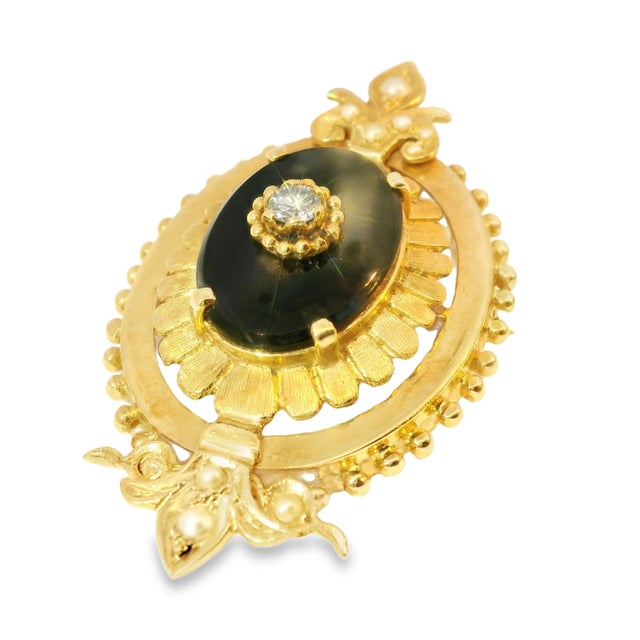 This stunning Victorian-era pendant showcases an elegant combination of natural onyx, a brilliant diamond, and delicate...