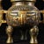 This extraordinary pair of monumental Chinese censers (incense burners) is crafted from bronze with extensive gold (gilt)...
