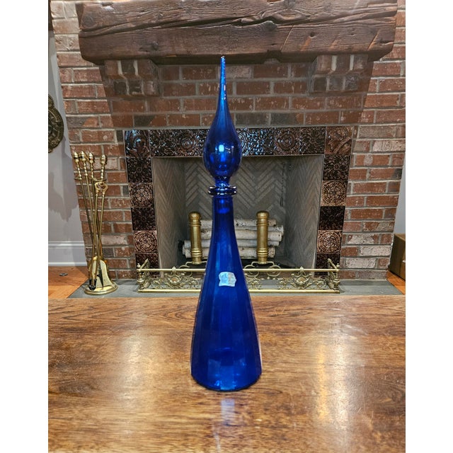 Offered here is a beautiful, authentic piece of Mid-Century Modern (MCM) art glass: a 17-inch Empoli Italian Genie Bottle...