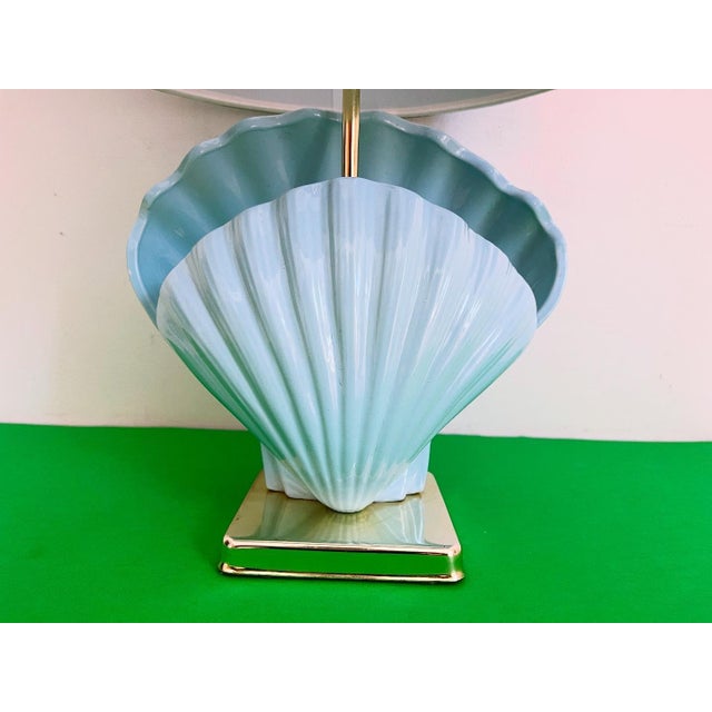 Beautiful 1970s ceramic double open scallop shell lamp in a richly glazed sky blue with fluted ridges, ribbon edges, and...