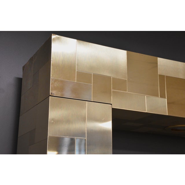 An exquisite brass patchwork bridged headboard with two recessed reading light lamps designed by Paul Evans for...