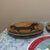 Folk Art 1980s Warren Kimble for Sakura "Horseshoe Inn" Ceramic Salad Plates - Pair For Sale - Image 3 of 5