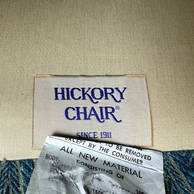 Vintage Hickory Chair Settee—two available A small Chippendale style sofa with a wooden stretcher and carved legs. These...