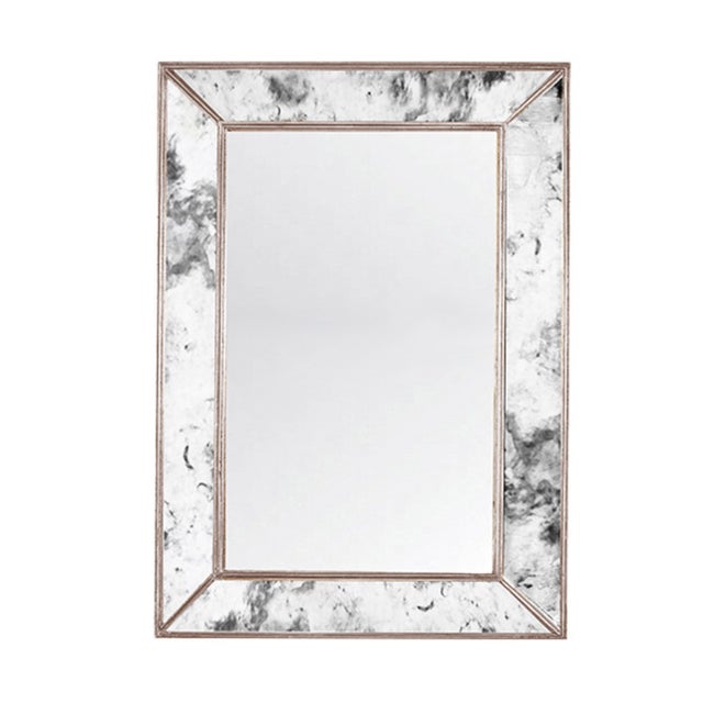 Reflect serious style anywhere you hang it. Four antique mirror facets are expertly finished with champagne silver leaf...