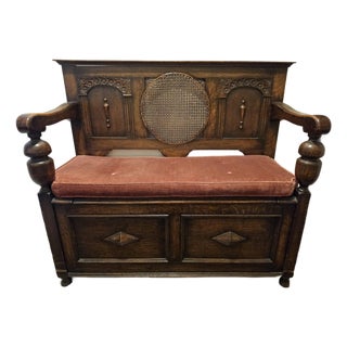 Antique Oak Hall Bench Features Intricate Carvings and a Circular Cane Insert in the Backrest, Late 19th Century For Sale