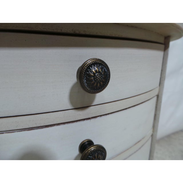 This is a very unique set of Gustavian style Oval 3 drawer nightstands. They have been restored and repainted with Milk...