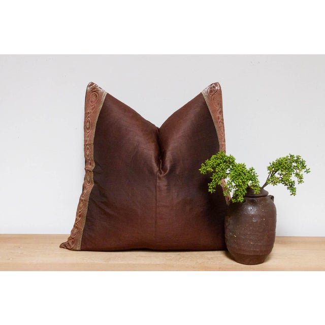 This brilliant silk euro pillow is a luxurious addition to any living room. Made out of silk with intricate borders of...