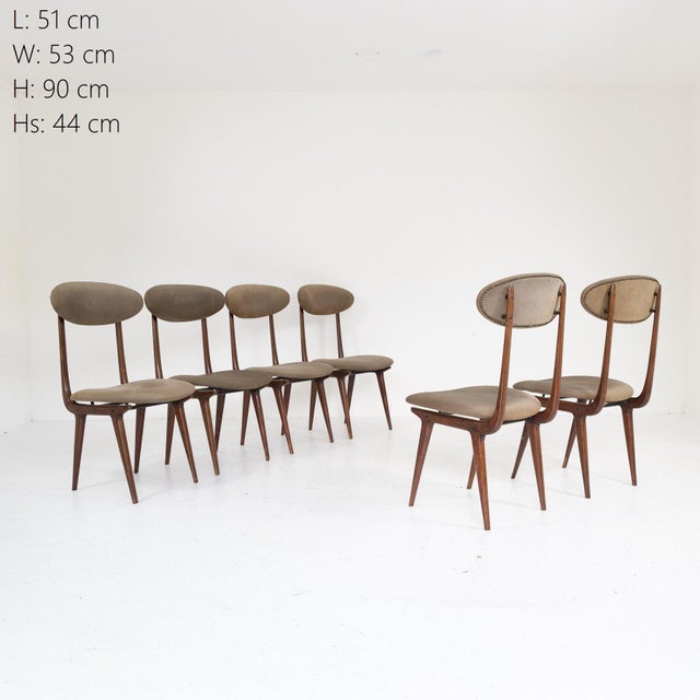 Teak wood frame with oval padded backrest fixed to shaped rear supports. Padded seat upholstered in original grey fabric...