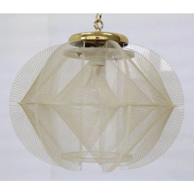 Mid-Century Modern Lucite and fish line pendant light fixture chandelier.