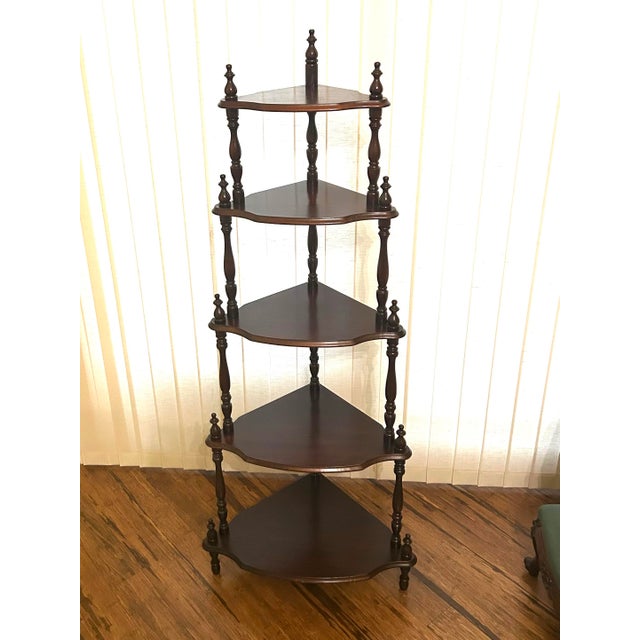 The stunning, antique, mahogany, five-tier corner etagere has beautifully turned, spindle supports and stick and ball...