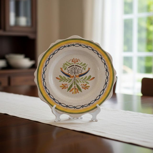 This nineteenth-century faience plate represents the vernacular ceramic traditions of rural France. Formed in a scalloped...