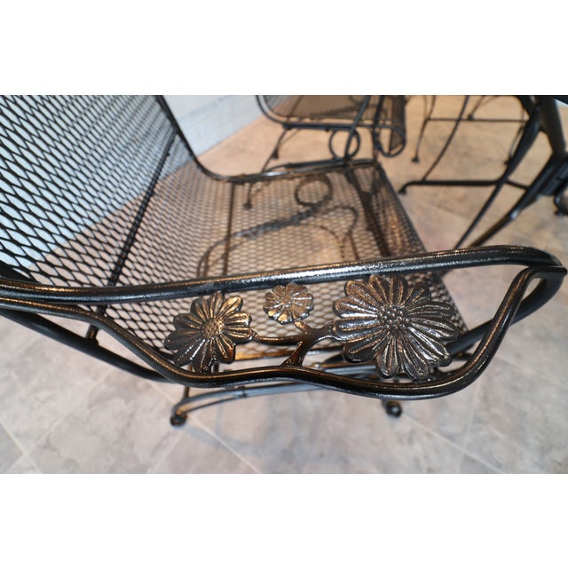 A handsome seven-piece American wrought-iron patio dining set by Russell Woodard, circa 1960s–1970s. The ensemble includes...