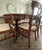 A beautifully crafted vintage mahogany dining set by Northern Furniture Company of Sheboygan, Wisconsin, a respected...