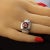 This is part of Chairish’s Costume Jewelry assortment. Striking Sterling Silver Cocktail Ring with Cushion Cut Pinkish Red...