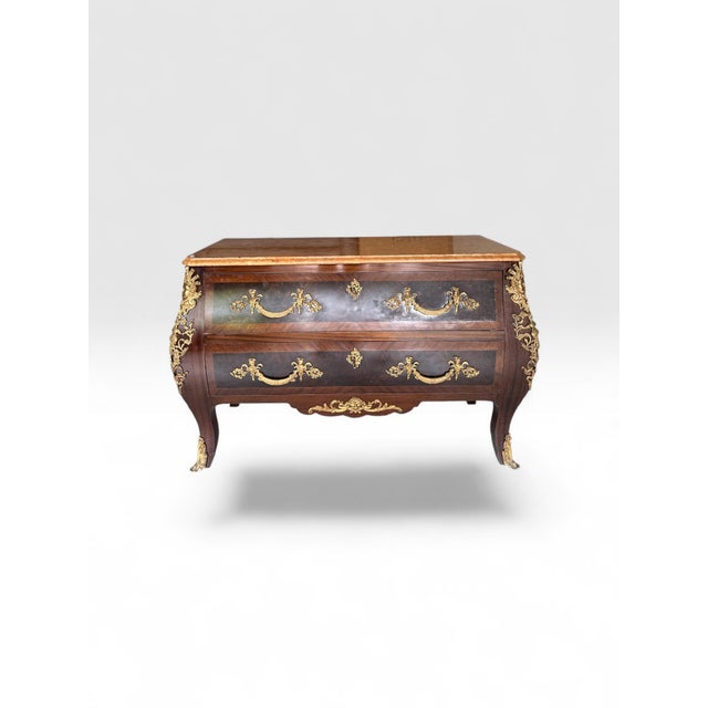 Stunning Louis XV-style Commode with Marble Top An elegant Louis XV-style commode, characterized by its classic curves and...
