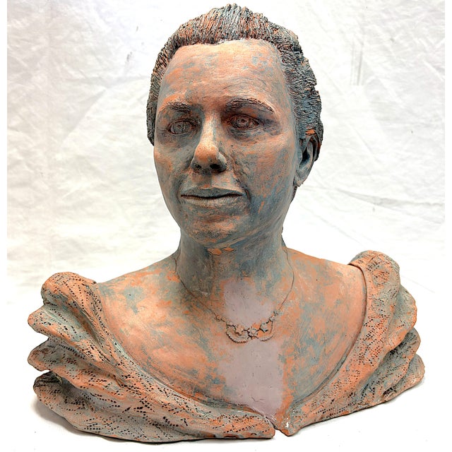 Very interesting original signed and dated bust sculpture circa 1991. It is made of terra cotta with a gray modeled finish...