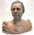 Very interesting original signed and dated bust sculpture circa 1991. It is made of terra cotta with a gray modeled finish...