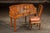 Hand-carved hardwood desk and matching chair set featuring intricate bas-relief carvings throughout. This Chinese scholars...
