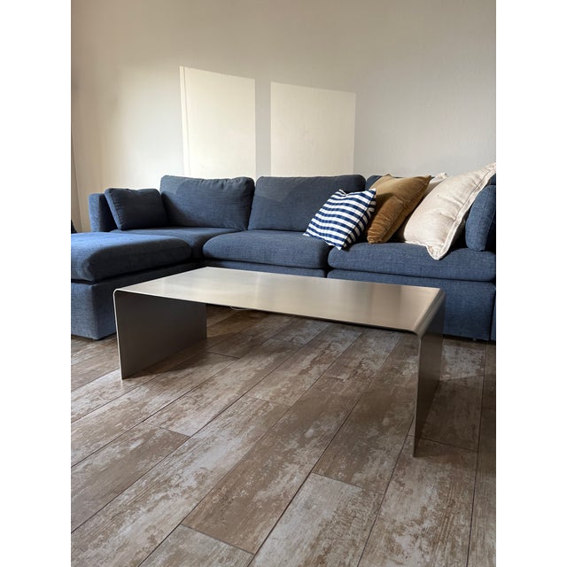 This striking Judd Coffee Table from Hue-Gah Home features a sculptural, minimalist silhouette crafted entirely from...