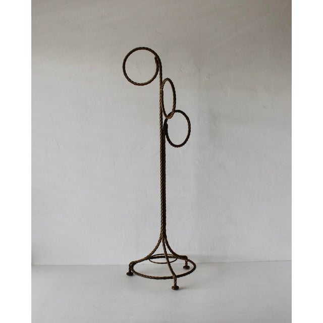 Freestanding Hoops Towel Rack Vintage Hollywood Regency. The three-hoop towel holder features a gold-toned metal finish...