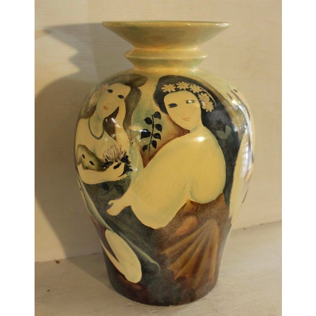 Elegant mid-century ceramic vase with a simple, sculptural form and rich glaze. Its understated design highlights the...