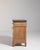 A brown wood, French Provincial-style chest of drawers from the 1900s, made in France. Crafted in wood with stone...