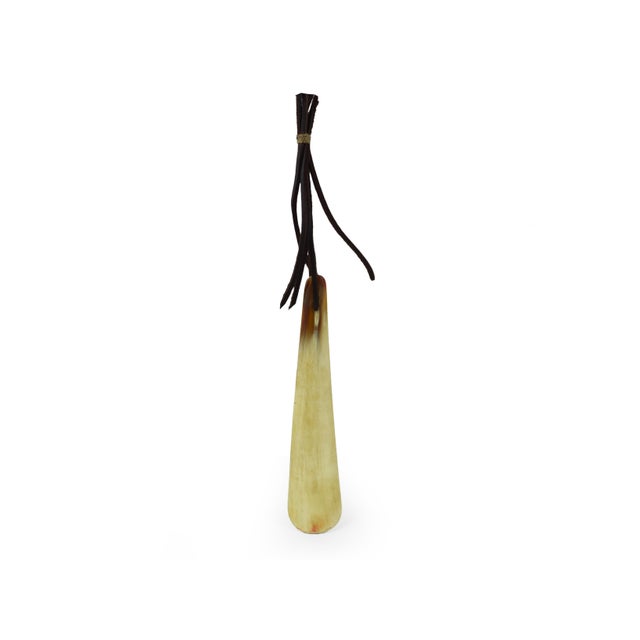 This beautifully crafted shoehorn is a vintage piece made from natural buffalo horn, showcasing the unique texture and...