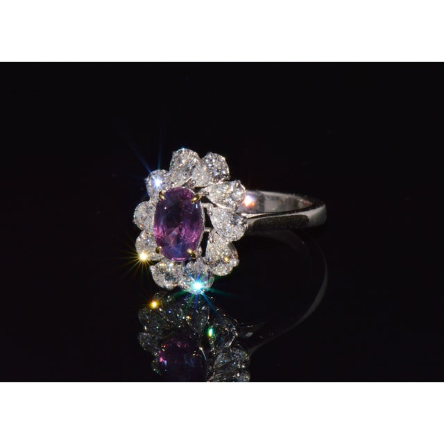 GIA certified 3.15CTS diamond and purple pink sapphire 18K solid gold ring. This ring features a large 1.43CTS natural no...