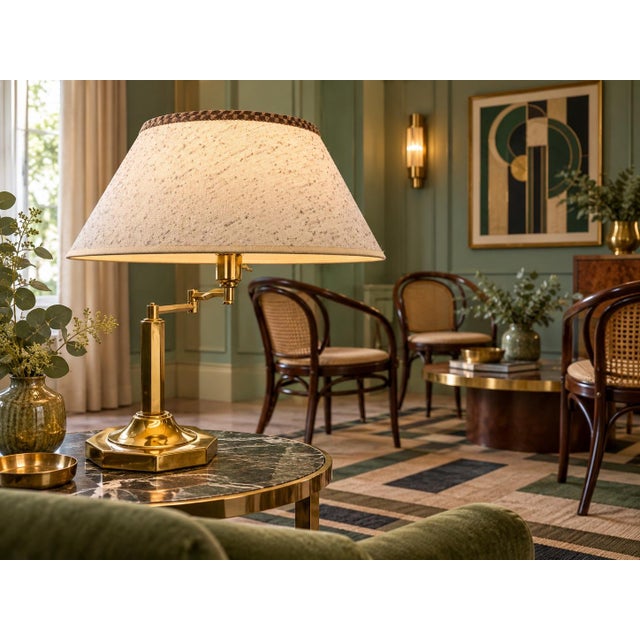 A vintage brass desk lamp by Dynasty Classics, dated 1988. This lamp features a heavy octagonal brass base and a swivel...