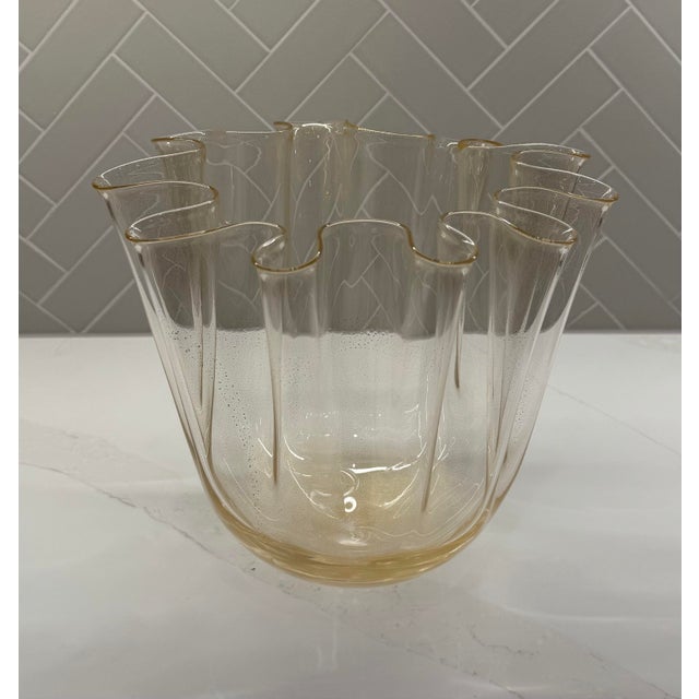 A dramatic hand-blown Italian art glass vessel from Global Views, executed in the iconic “handkerchief” form with a softly...