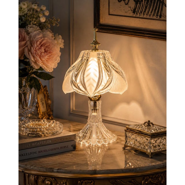 A charming vintage Yugoslavian table lamp crafted in brilliant 24% lead crystal, featuring an unusually sculptural floral-...