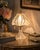 A charming vintage Yugoslavian table lamp crafted in brilliant 24% lead crystal, featuring an unusually sculptural floral-...