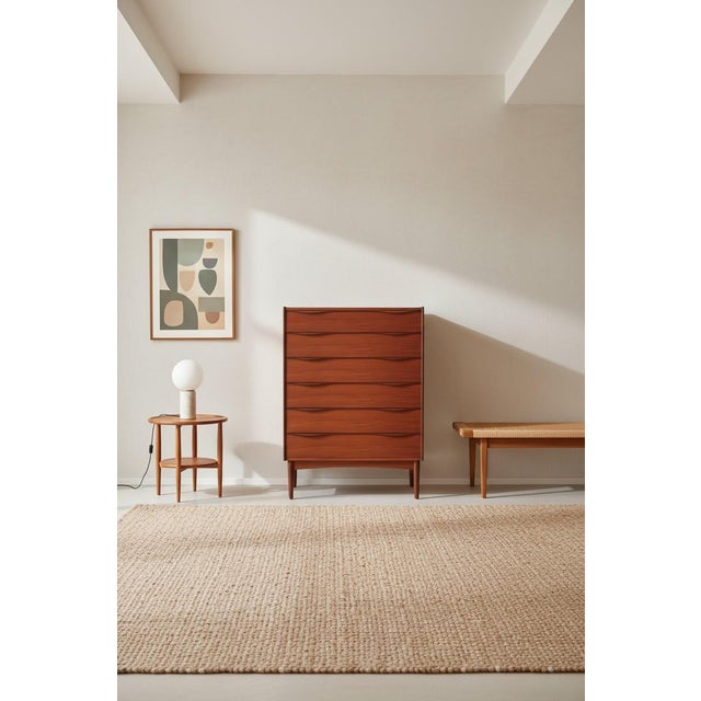 An incredibly well-crafted Danish teak chest of drawers with six spacious drawers and a design that combines function,...