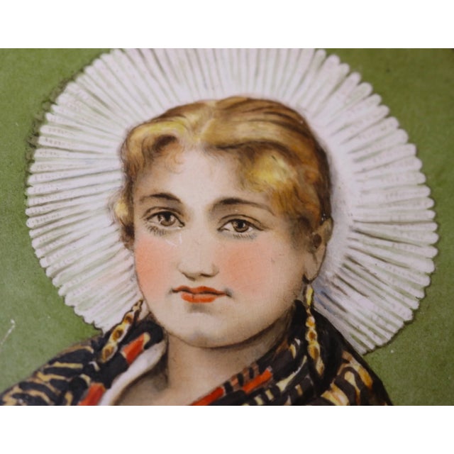 Up for sale is a wonderful antique hand painted porcelain portrait trivet. It's beautifully tri-footed with scrolled legs...