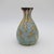 A Desvres Fourmaintraux Delassus Art Nouveau vase from France, dating circa 1930. The faience vessel is skillfully...