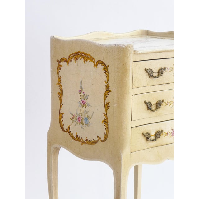 Antique Venetian chest of drawers with hand painted pink flowers and details. The side table has 3 drawers that open with...
