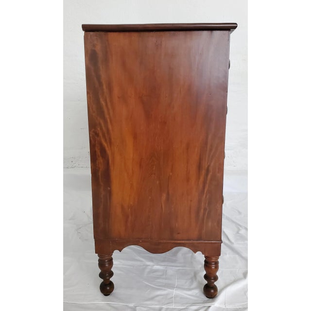 Beautiful tone and patina on this Sheraton chest of drawers with brass handles. Drawers glide open and shut with ease....