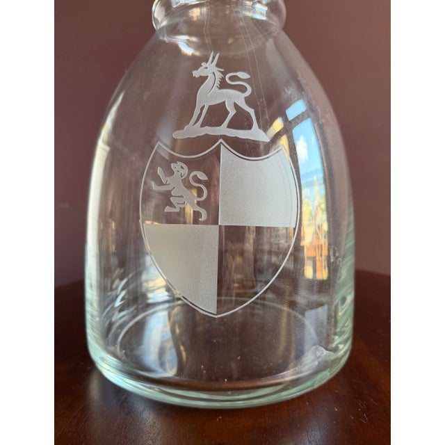 Beautiful and quite unusual Extra Large decanter with interesting etched crest. Great statement for bar, kitchen counter,...