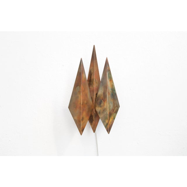 This diamond-shaped copper sconce was designed by Svend Aage Holm Sorensen. Labeled by Maker,Labeled with Country of...