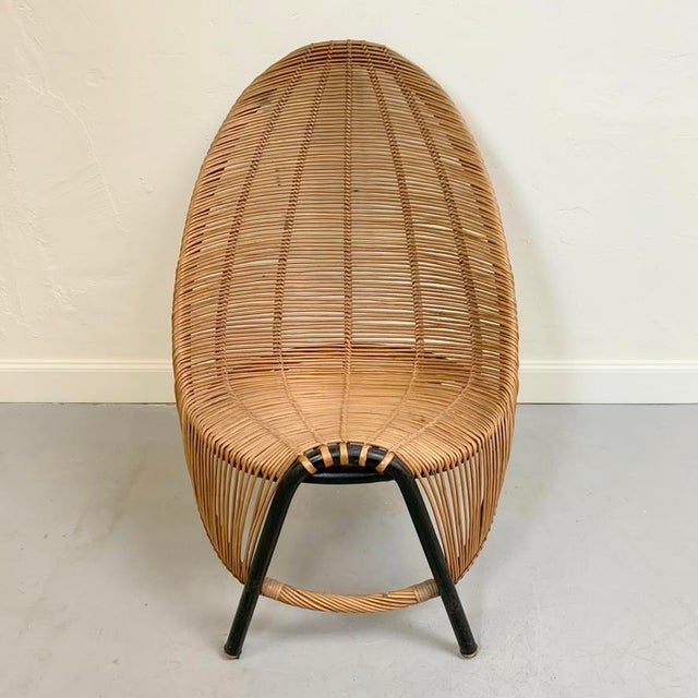 Władysław wołkowski sculptural lounge chair,circa 1955, poland. wicker, black tubular metal. dimensions: 93 cm h, 65 cm w,...