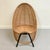 Władysław wołkowski sculptural lounge chair,circa 1955, poland. wicker, black tubular metal. dimensions: 93 cm h, 65 cm w,...
