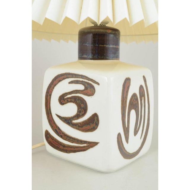 Carl-Harry Stålhane for Rörstrand, “Orient” table lamp. Ceramic table lamp in stoneware with hand-decorated relief in...