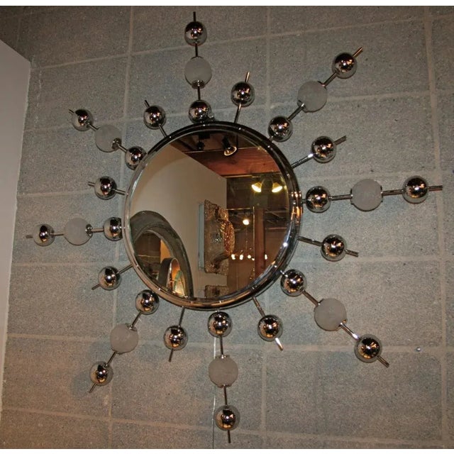 It's a sputnik mirror waiting to be hung and noticed anywhere!!!! in your humble abode, workplace, bedroom...