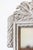 A Danish gray painted wood mirror from circa 1800 with carved crest. This exquisite Danish painted wood mirror, dating...