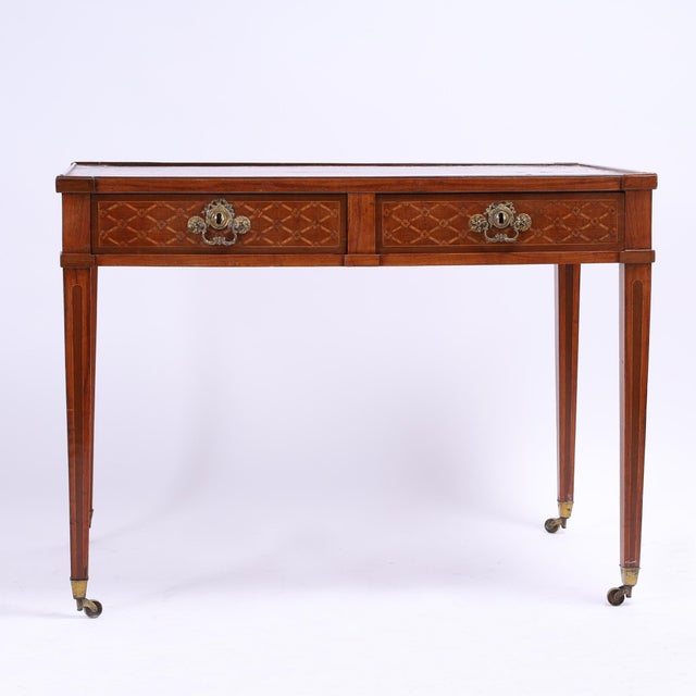Handsome 19th century French Restoration period writing desk handcrafted in exotic woods including mahogany and walnut...